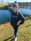 woman in black leopard sweatshirt with printed pray on the front