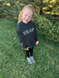 toddler in pray black leopard sweatshirt