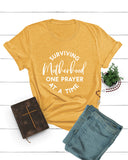 Surviving Motherhood One Prayer At a Time Tee