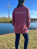 woman in crimson red crewneck with if you have time to worry you have time to pray on back
