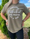 Surviving Motherhood One Prayer At a Time Tee